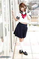 Legs crossed wearing kogal uniform