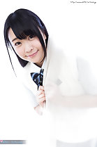 Minano Ai looking out from behind curtain