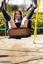 Playing on swing legs raised