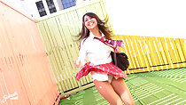 Wearing uniform in garden plaid skirt blown up over upskirt panties
