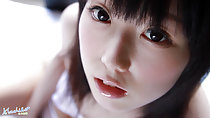 Machiko looking up fringe down to her eyes lips parted