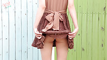 Raising hem of dress up over her ass brown bow