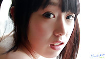 Machiko looking over her shoulder lips parted