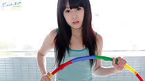 Holding hula hoop long hair wearing striped vest