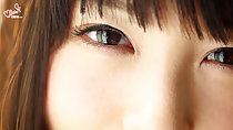 Auburn hair framing her eyes