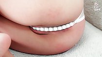 Legs raised on sofa thong panties between her labia