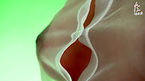 Bare breasts straining against her see through top