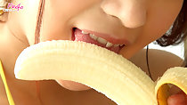 Licking peeled banana