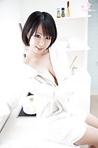 Seated in bathroom showing cleavage short hair