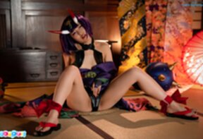 Aika Suzumiya seated with legs spread masturbating