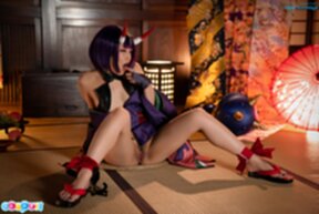 Aika Suzumiya seated with legs spread masturbating