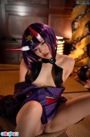 Aika Suzumiya seated with legs spread masturbating