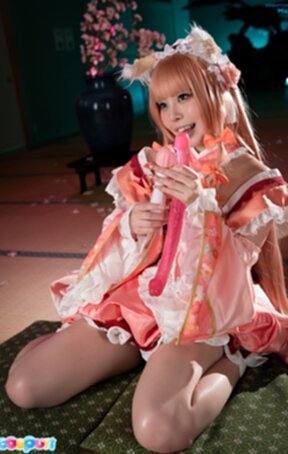 Misa on her knees licking and sucking dildo