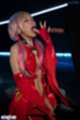 On her knees licking cum from her fingers