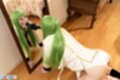 On all fours in front of floor standing mirror sucking black dildo
