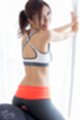 Leaning against window looking over her shoulder wearing workout gear giving assjob