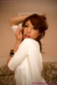 Sakuraba aya in white dress arms raised