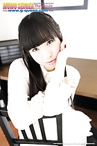 Kokomi Shiozaki sitting on chair long hair down to her chest her arms crossed