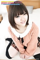 Kneeling on bed leaning forward hands between her parted thighs in black socks
