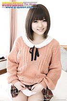 Smiling sweetly short hair framing her features in sweater raising short skirt over her panties