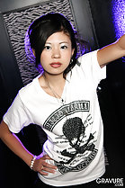 Mia in white tshirt hand on hip