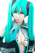 Squeezing her breasts together