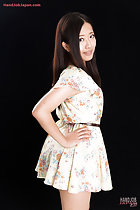 Fukatsu Miyuki with hand on hip looking over her shoulder long hair