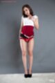 Dress raised over scarlet panties