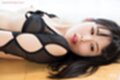 Lying on her back back arched looking to the side