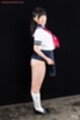 Standing in uniform skirt raised over her ass