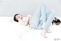 Yurikawa Sara lying on her back knees drawn up bare feet