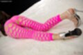 Kazuki yuu lying on her front wearing pink pantyhose high heels.jpeg