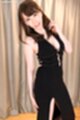 Playing with her hair in evening dress