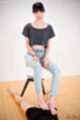 Sitting on stool wearing jeans teasing cock with bare feet