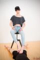 Matsuda anna seated giving footjob hands on her thighs wearing jeans bare feet