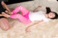 Giving footjob between her bare feet in pink leggings