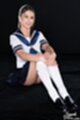 Seated with knees drawn up wearing kogal uniform.jpeg