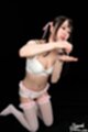 On her knees wearing bra in stockings garter belt playing with cum