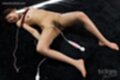 Oshima karina lying naked and exhausted shibari rope loosened over her small breasts legs spread bare feet sex toy lying between her spread legs