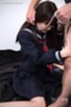 On her knees in kogal uniform wearing bondage chain