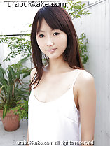 Long hair straggling over her shoulder wearing white slip