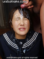 Man standing over her cumming over her hair and forehead face slick with bukkake